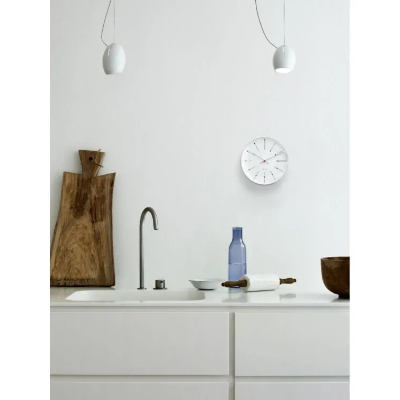 The Banker's Wall Clock from Arne Jacobsen Watches in a kitchen.