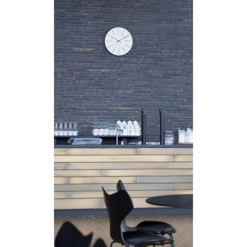 The Banker's Wall Clock from Arne Jacobsen Watches in an office.