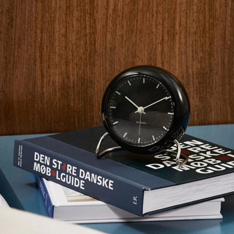 The City Hall Alarm Clock from Arne Jacobsen Clocks in an office.