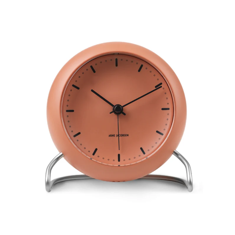 The City Hall Alarm Clock from Arne Jacobsen Clocks in pale orange.