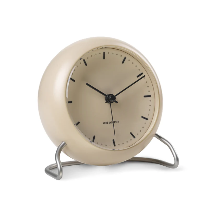 The City Hall Alarm Clock from Arne Jacobsen Clocks in sandy beige from the side.