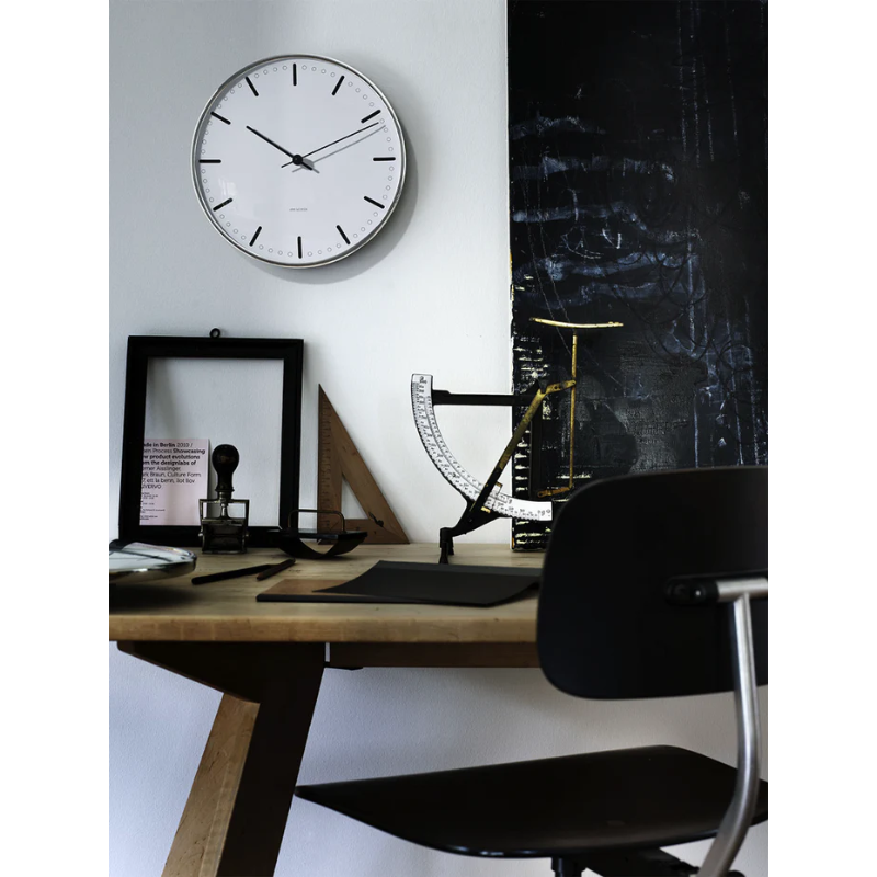 The City Hall Wall Clock from Arne Jacobsen Clocks in a home office.