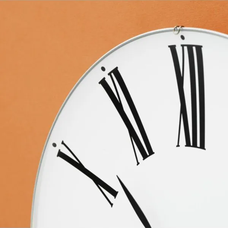 The Roman Wall Clock from Arne Jacobsen Clocks in a close up.