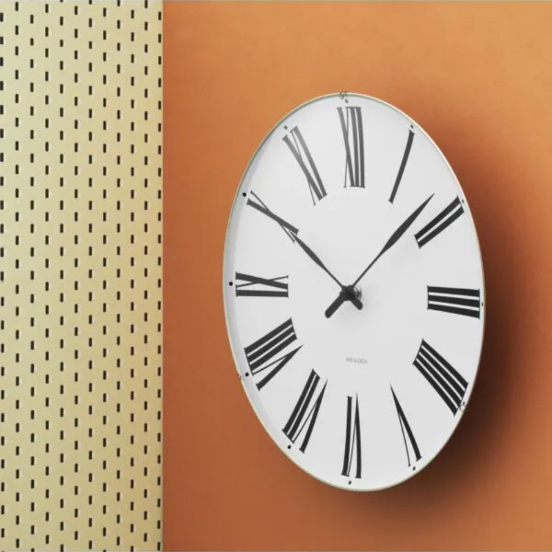 The Roman Wall Clock from Arne Jacobsen Clocks in a living room.