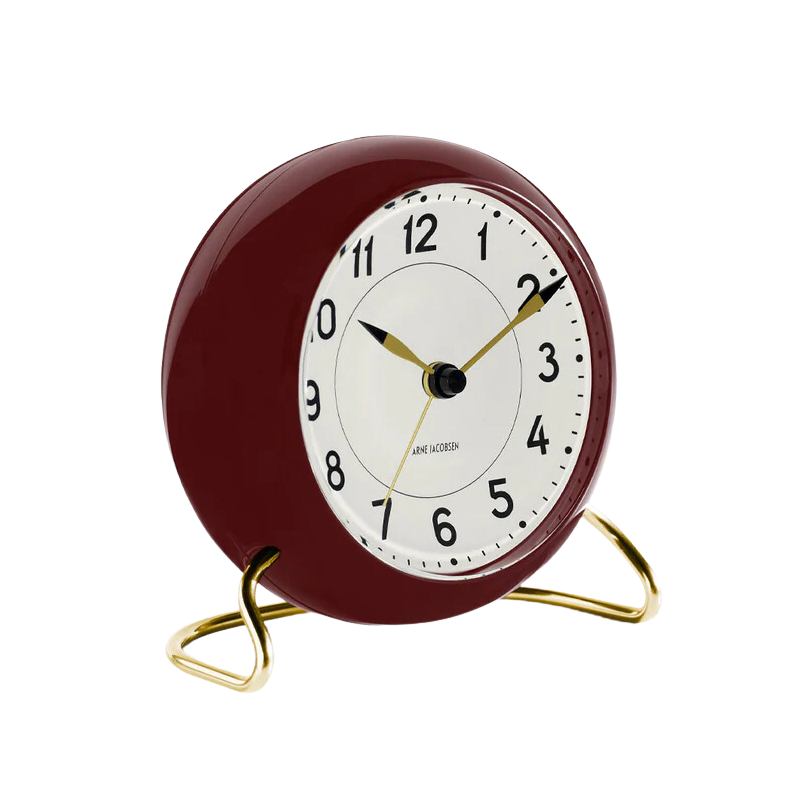 The Station Alarm Clock from Arne Jacobsen in burgundy from the side.