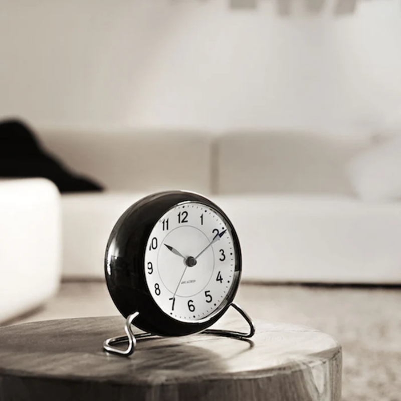 The Station Alarm Clock from Arne Jacobsen in a living room.