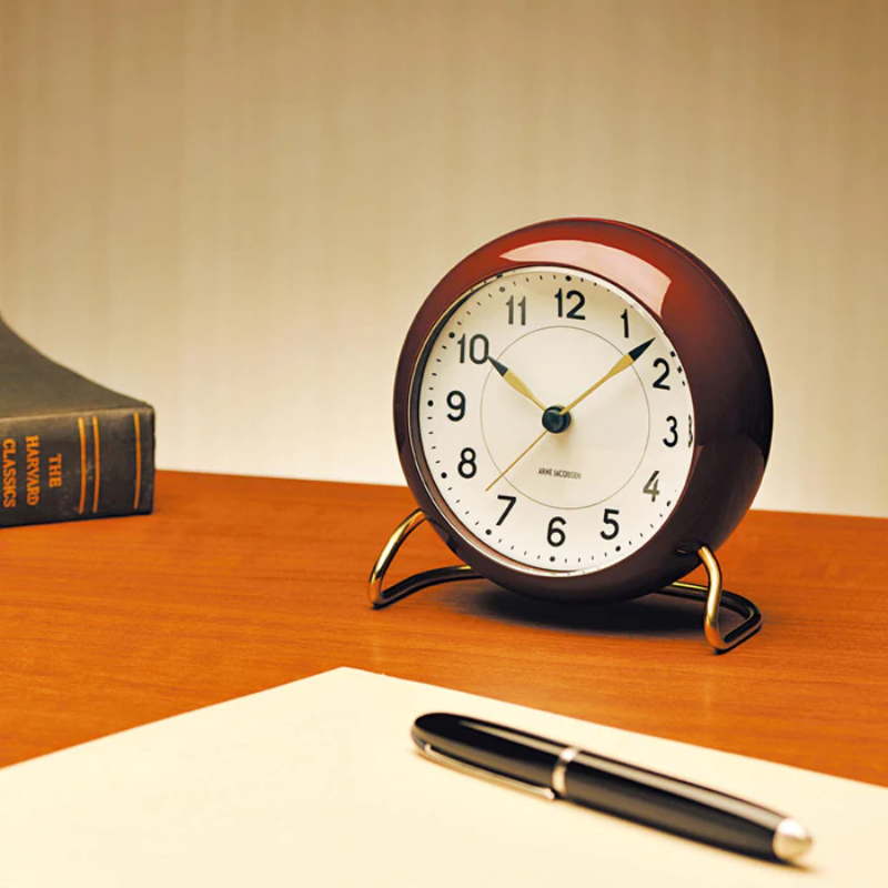 The Station Alarm Clock from Arne Jacobsen in a work place.