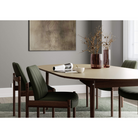 The Extendable Oma Dining Table from Eikund of Norway in a dining room.