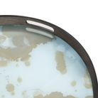 The Organic Glass Tray from Ethnicraft round shape, small size in mist gold in a close up.