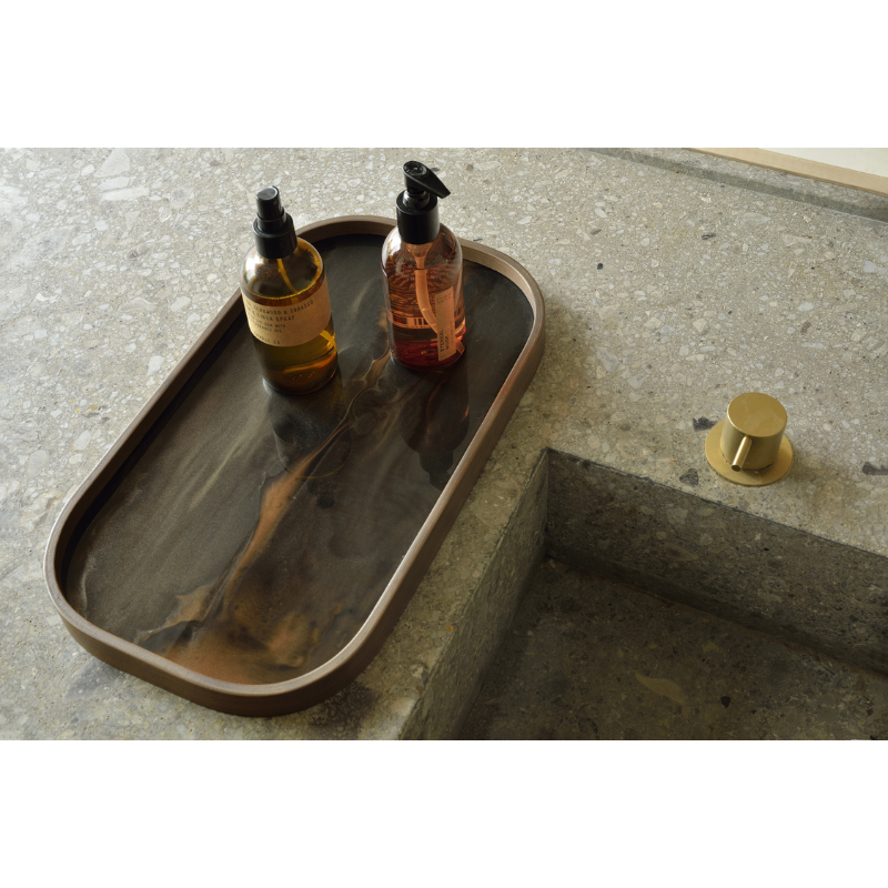 The Organic Valet Tray from Ethnicraft in a bathroom.