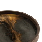 The Organic Valet Tray from Ethnicraft round shape in bronze close up.