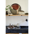 The Overlapping Dots Glass Tray from Ethnicraft in a kitchen.