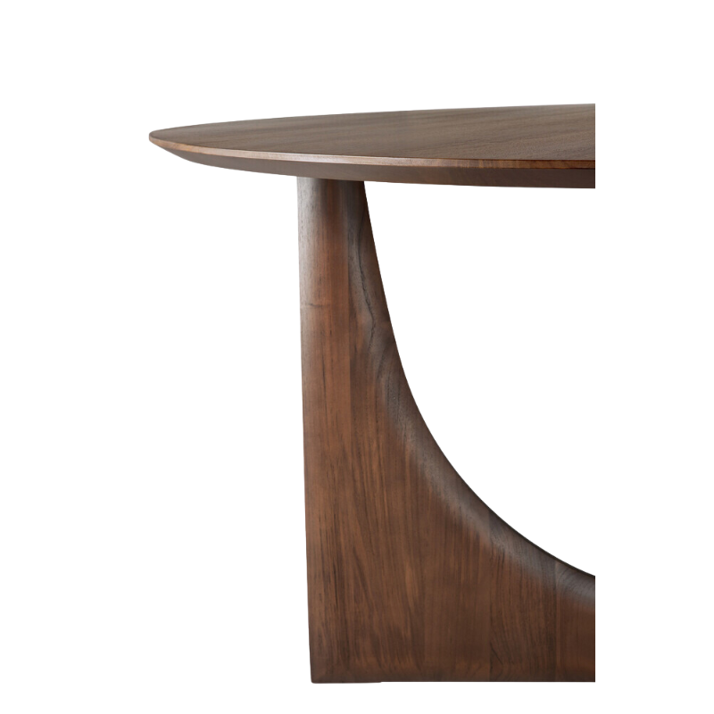 The Round Geometric Dining Table in Teak Brown from Ethnicraft in a photograph highlighting the table top.