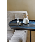 The Tray Side Table from Ethnicraft being used for kitchen and dining accessories.