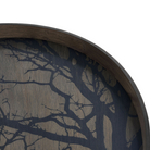 The Tree Wooden Tray from Ethnicraft round shape, size medium in black in a close up.