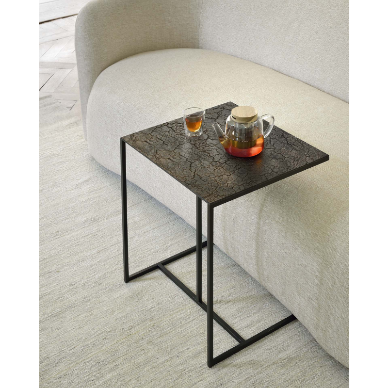 The Triptic Side Table from Ethincraft in whisky in a family space.