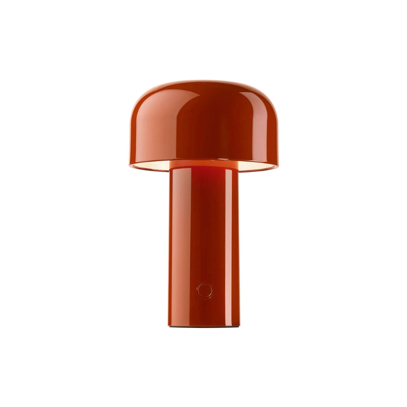 The Bellhop Portable Table Lamp from FLOS in burnt orange.