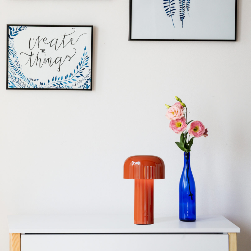 The Bellhop Portable Table Lamp from FLOS in an entryway.