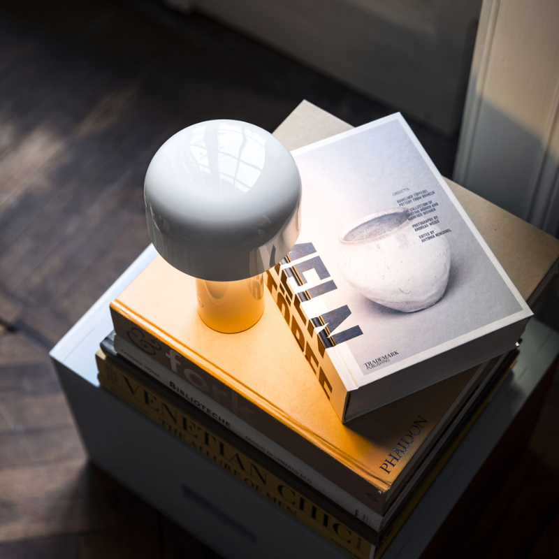 The Bellhop Portable Table Lamp from FLOS in a family space.