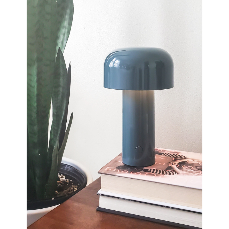 The Bellhop Portable Table Lamp from FLOS in a home.