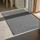 The Stein Doormat from Heymay in large size in an entryway.