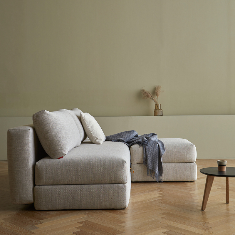 The Cornila Ottoman from Innovation Living in a living room.