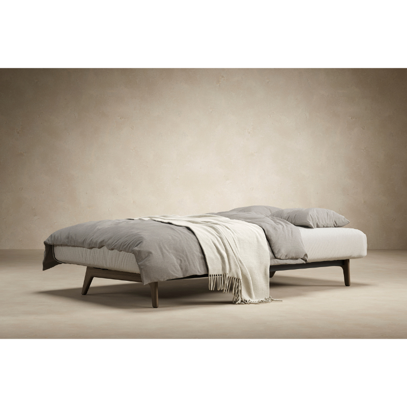 The Dublexo Eik Sofa Bed Smoked Oak from Innovation Living in a lounge.