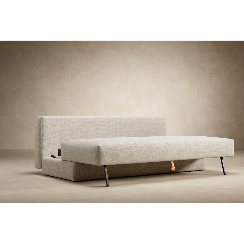 The Osvald Sofa Bed from Innovation Living highlighting the space saving aspects of the furniture.