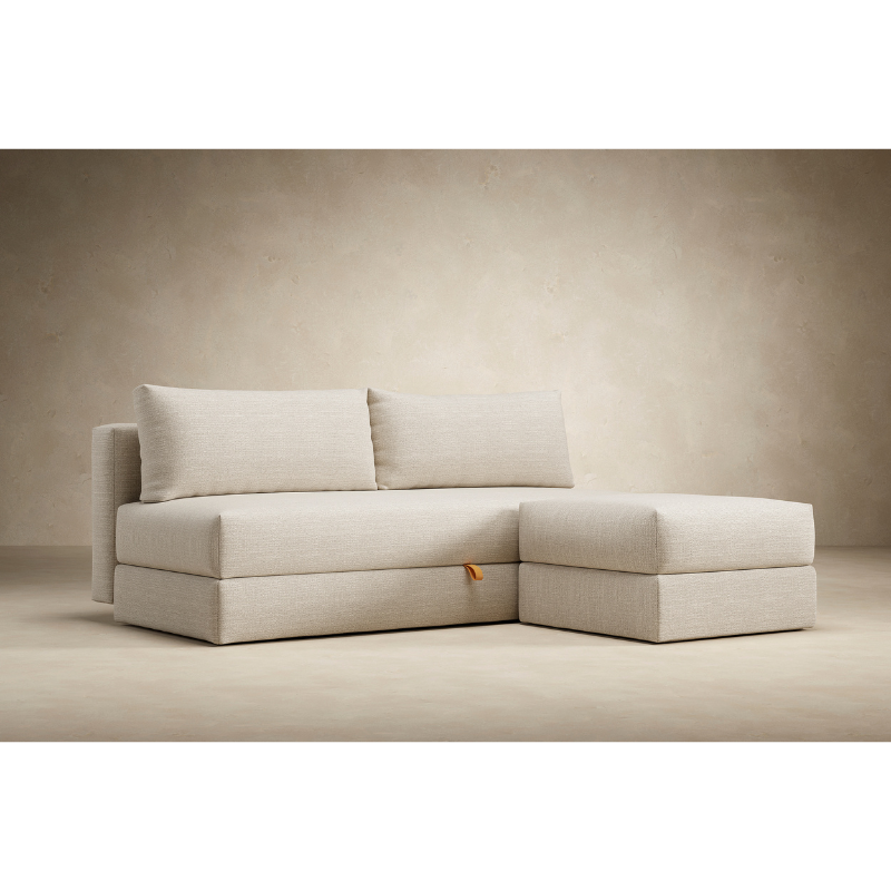 The Osvald Sofa Bed from Innovation Living with an ottoman.