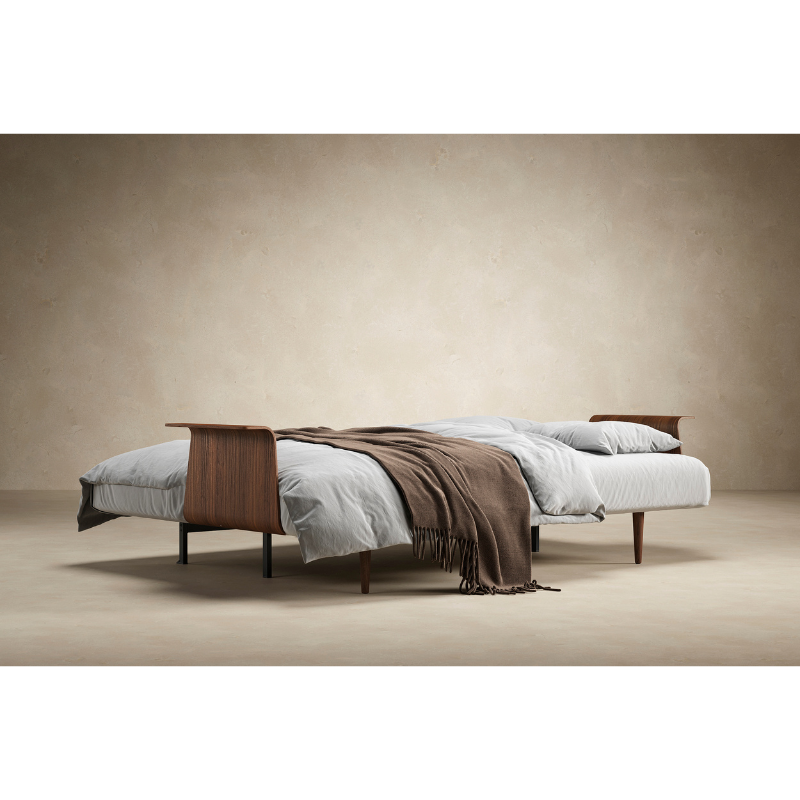 The Recast Sofa Bed Dark Styletto With Arms from Innovation Living used as a bed.