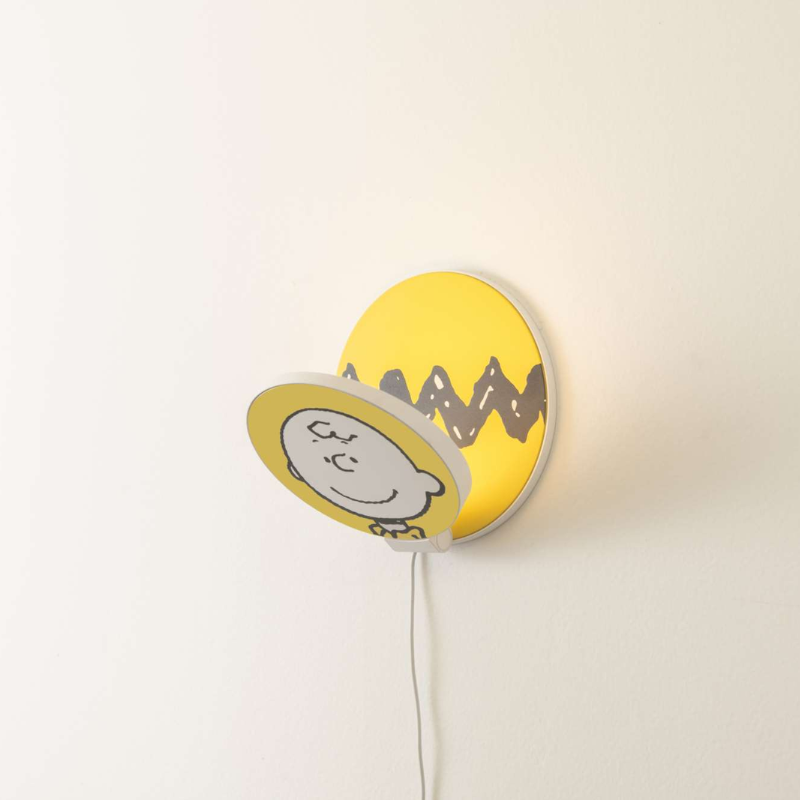 The Peanuts Edition Gravy Wall Sconce  from Koncept in the Charlie Brown style from the side.