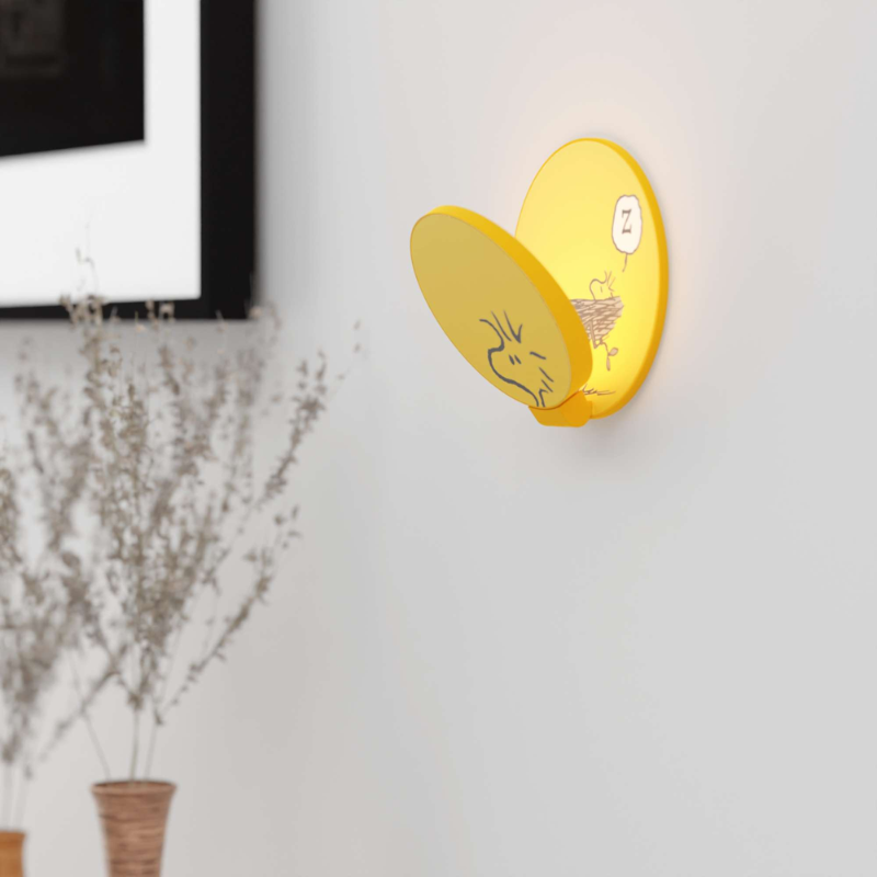 The Peanuts Edition Gravy Wall Sconce  from Koncept in the Woodstock style in a living room.