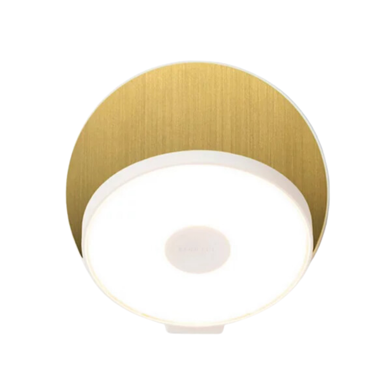 The Plug-In Gravy Wall Sconce from Koncept with the matte white body and brass plate.