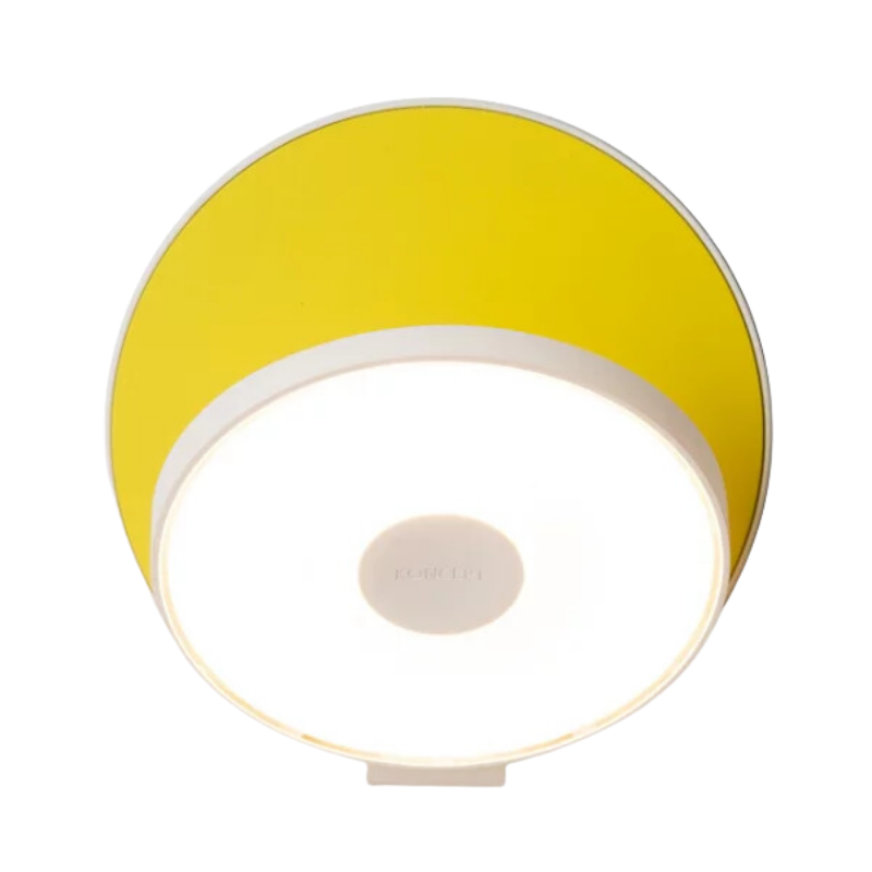 The Plug-In Gravy Wall Sconce from Koncept with the matte white body and matte yellow plate.