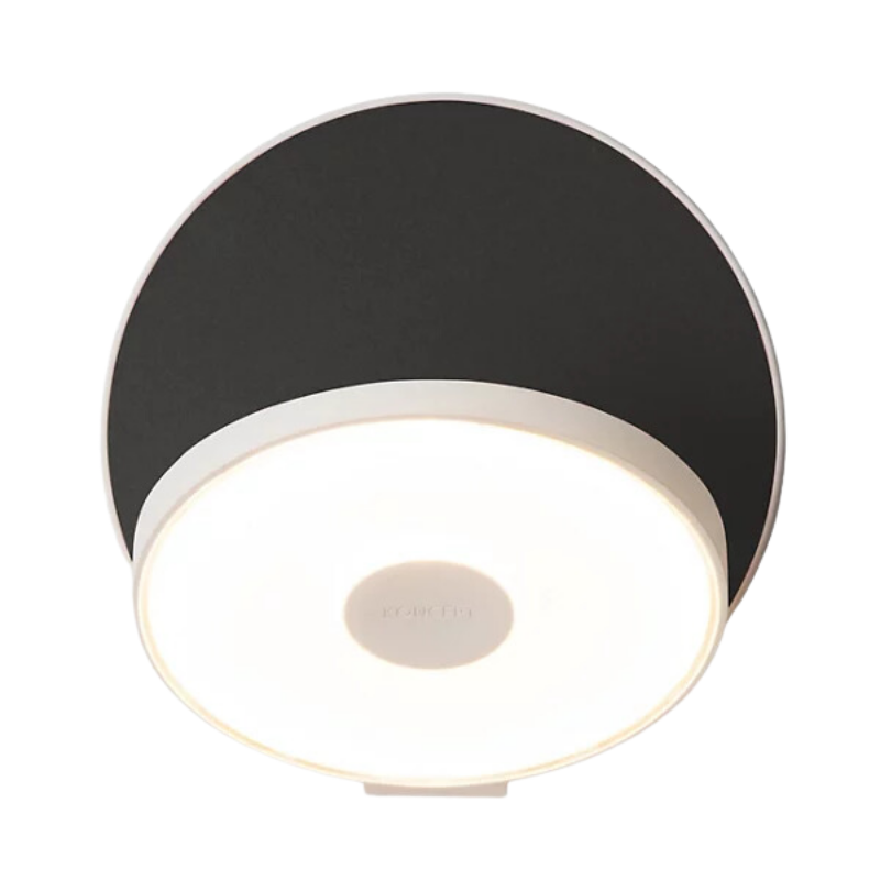 The Plug-In Gravy Wall Sconce from Koncept with the matte white body and metallic black plate.