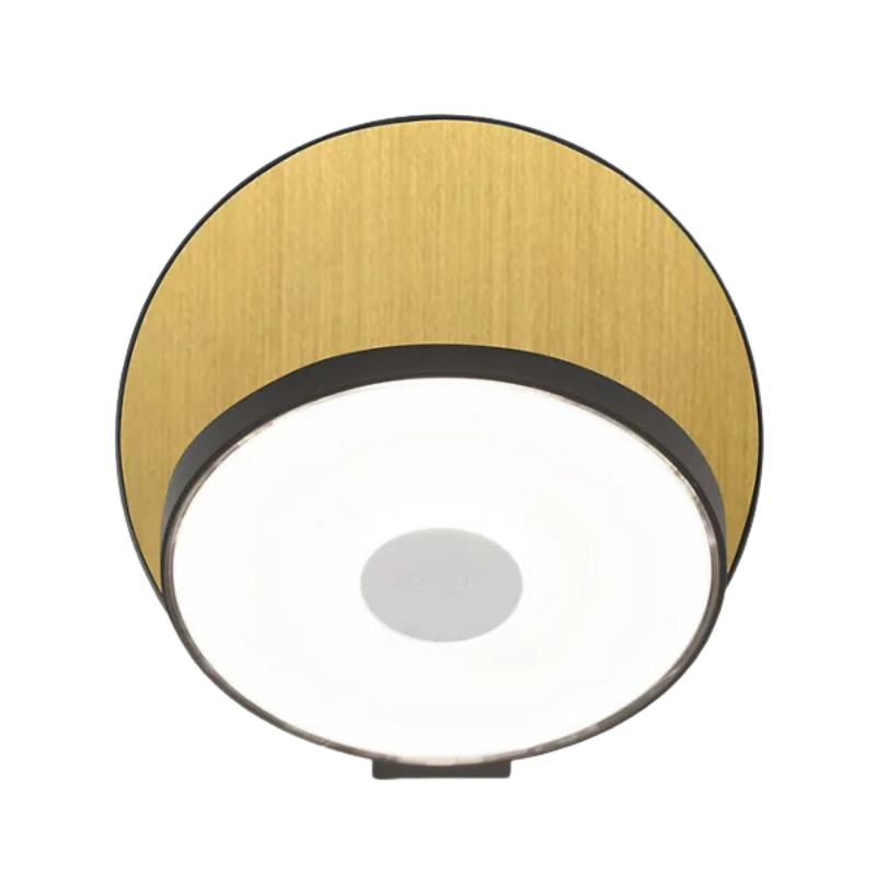 The Plug-In Gravy Wall Sconce from Koncept with the metallic black body and brass plate.