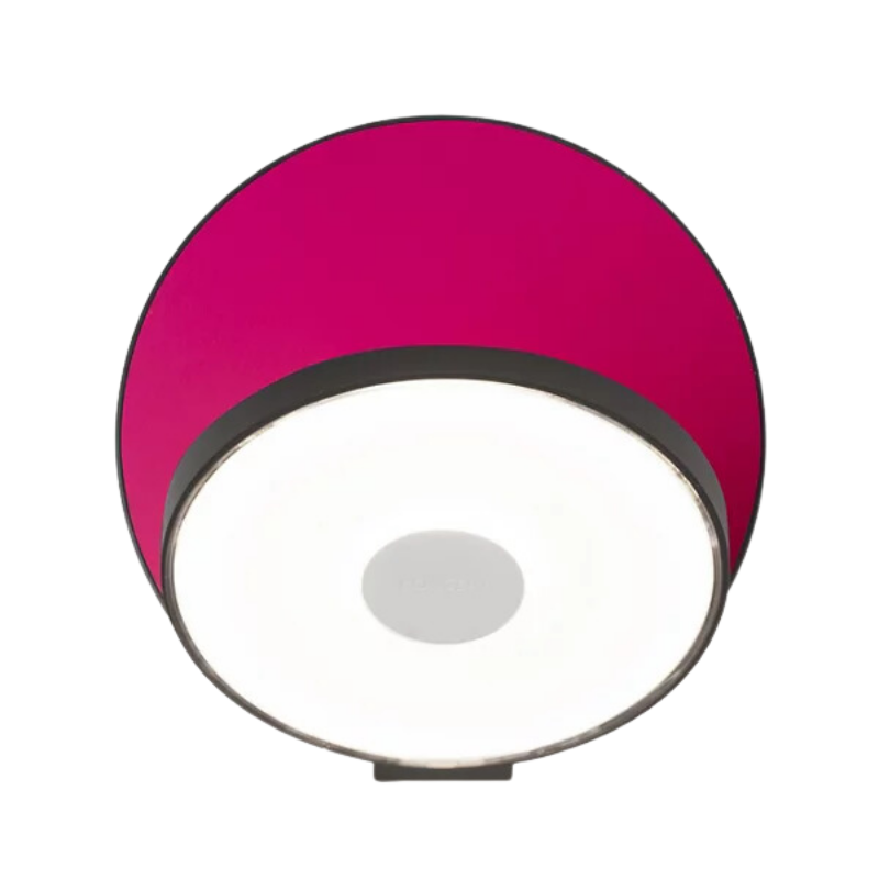 The Plug-In Gravy Wall Sconce from Koncept with the metallic black body and matte hot pink plate.