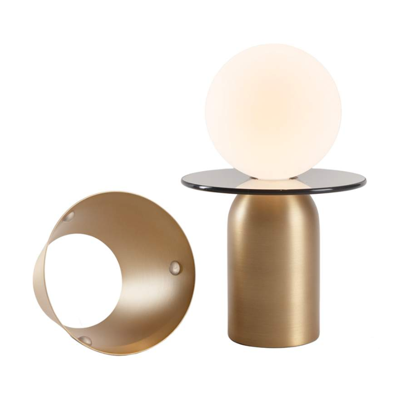 The Guy Portable Lamp from Koncept in brass with the disk collar.