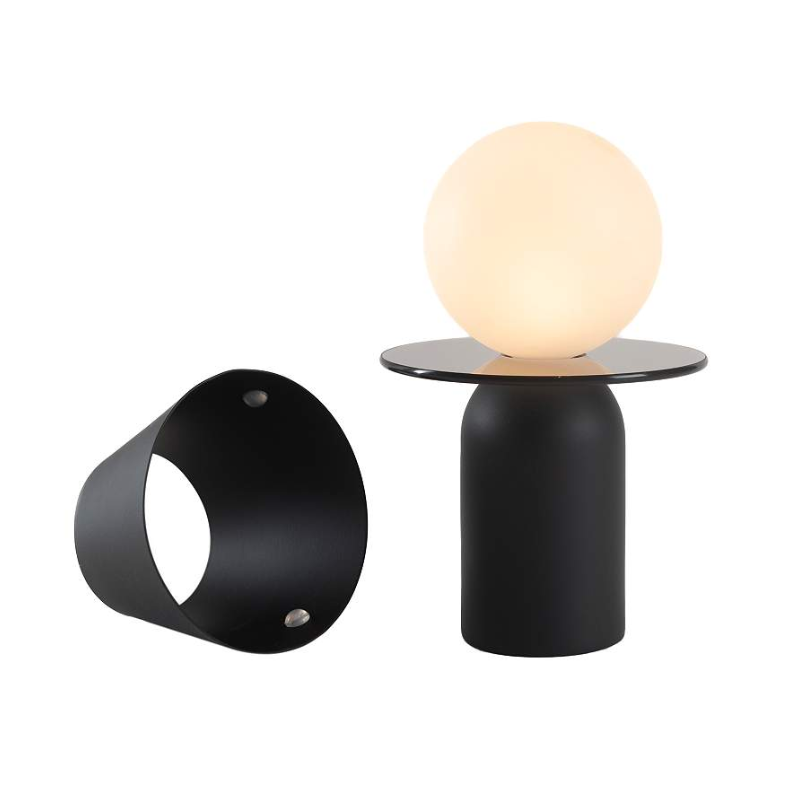 The Guy Portable Lamp from Koncept in matte black with the disk collar.