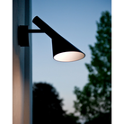 The AJ 50 Wall from Louis Poulsen used as an outdoor wall sconce.