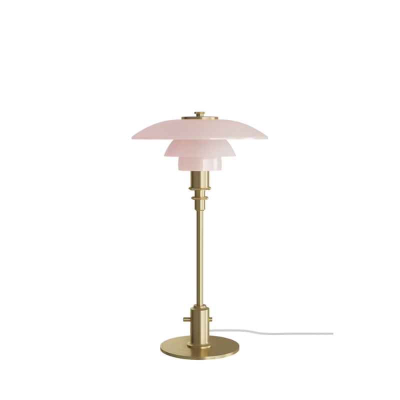 The PH 2/1 Pale Rose Brass Table Lamp from Louis Poulsen in a studio.