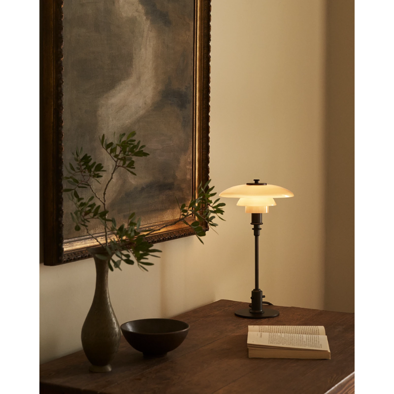 The PH 2/1 Dusty Terracotta Table Lamp from Louis Poulsen in a family space.