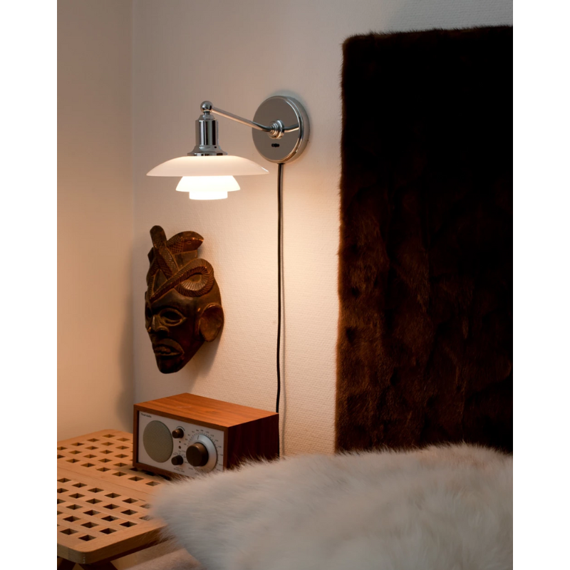 The PH 2/1 Wall Lamp from Louis Poulsen in a bedroom.