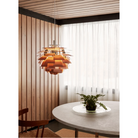 The PH Artichoke from Louis Poulsen in a kitchen and dining setting.