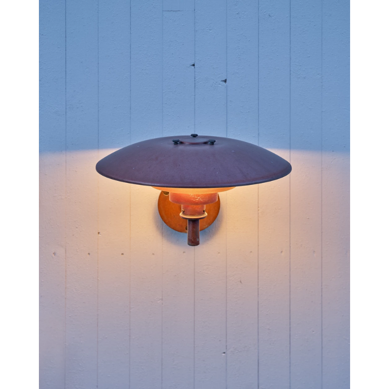 The PH Wall from Louis Poulsen used as an outdoor wall sconce.