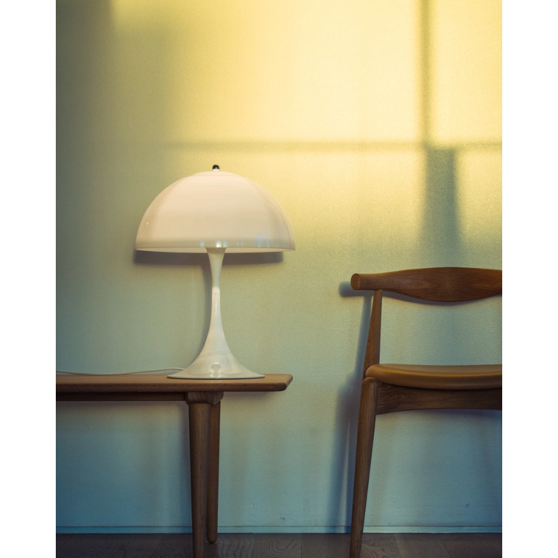 The Panthella 400 Table Lamp from Louis Poulsen within a family space.