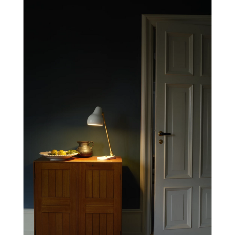 The VL38 Table from Louis Poulsen in a bedroom.