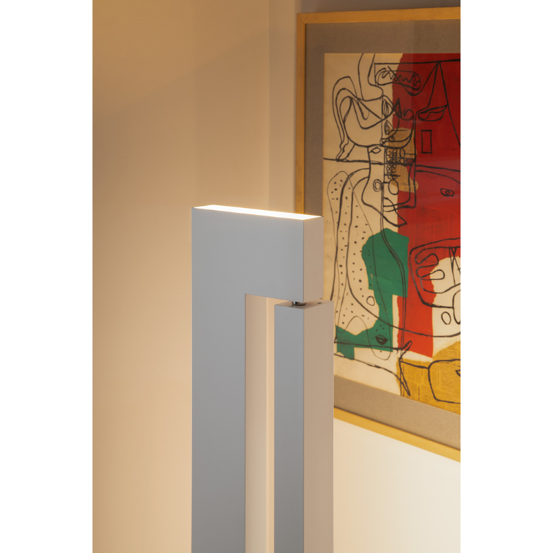 The Ara Floor Lamp from Nemo in a lounge highlighting the side and up emission light.