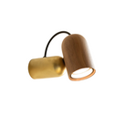 The Onfa Wall Lamp from Nomon with the walnut with brass finish.