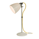 The Hector Bibendum Table Light from Original BTC in yellow in a studio.